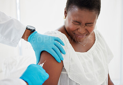 Buy stock photo Doctor, black woman and vaccine injection with pain on arm for safety, immunity and prevention. Covid, healthcare and medical professional with vaccination, cure or medicine for sore person in clinic