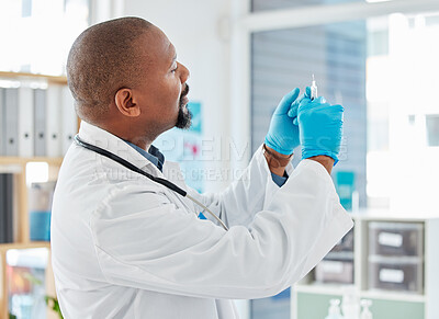 Buy stock photo Doctor, syringe and healthcare vaccination, injection or medicine for cure, pain or illness at hospital. Black man, medical professional holding filled needle for wellness or antibiotic at clinic