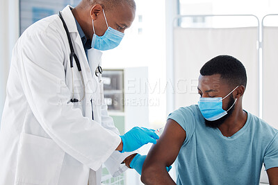 Buy stock photo Doctor, black man and vaccine injection for covid safety, immunity and prevention. Face mask, healthcare and medical professional with vaccination syringe, cure or medicine for patient in clinic.