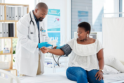 Buy stock photo Checkup, healthcare and a doctor with a black woman for hypertension, health check and service. Help, medical and a gp consulting with a patient for blood pressure exam, cardiology or monitor