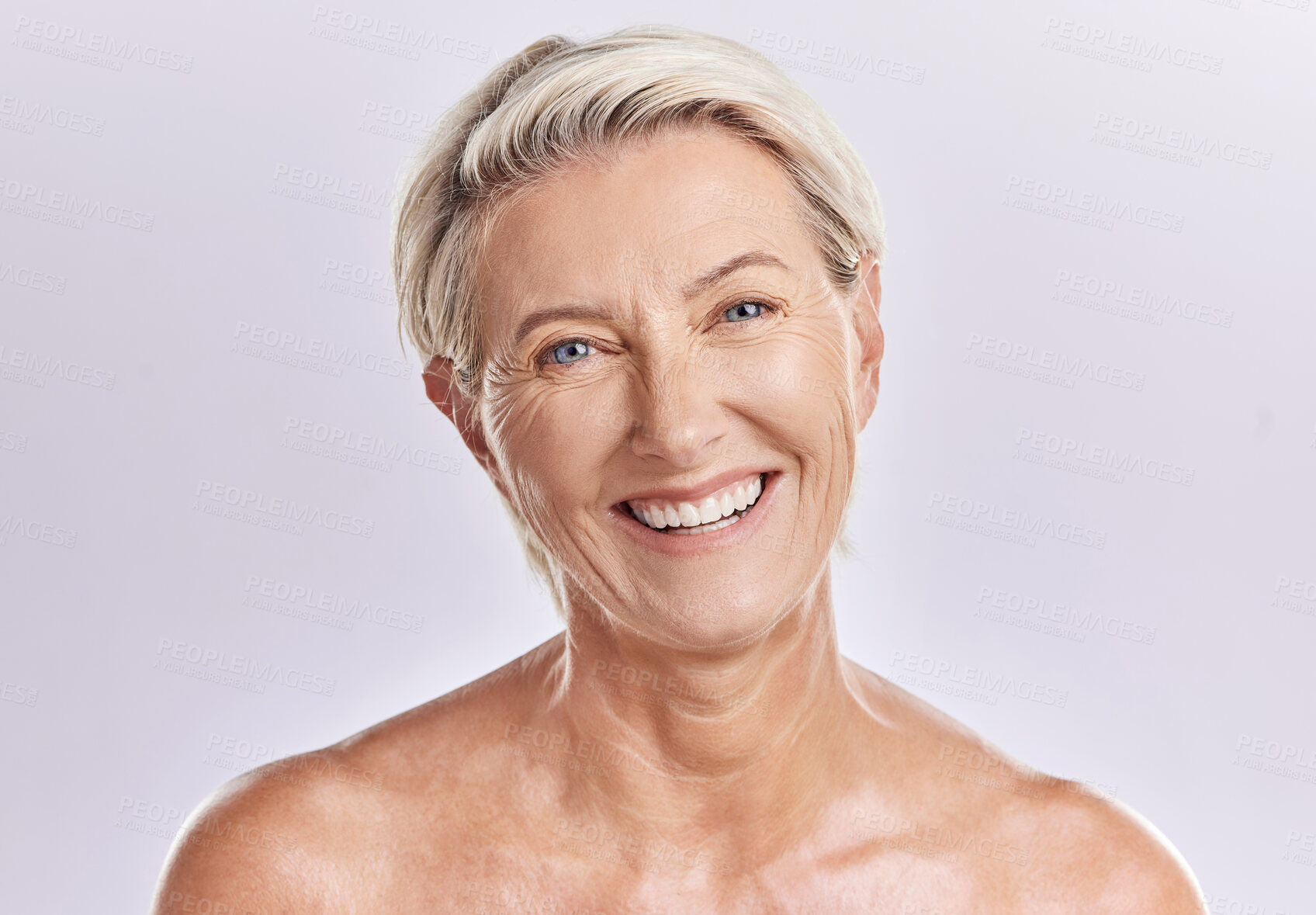 Buy stock photo Beauty and skincare of a senior woman with smooth skin and healthy teeth against a pink background. Portrait of a happy mature, elderly or old female smiling due to cosmetic wellness