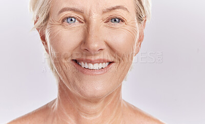 Buy stock photo Portrait of a happy senior woman's face against studio mockup background. Healthy and natural mature model with smooth skin. Feeling radiant and fresh with her healthcare or skincare cosmetic routine