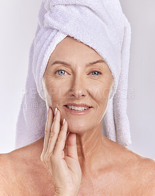 Buy stock photo Skincare, health and beauty, a senior woman, towel on head, and smile on her face, taking care of her skin after a shower. Portrait of happy, mature, elderly female and healthy treatment for wrinkles