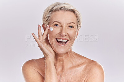 Buy stock photo Skin, skincare or collagen lotion with old woman posing with a smile with her cosmetics and product. Senior female, facial cream and sunscreen for a healthy face and beauty model wellness portrait.
