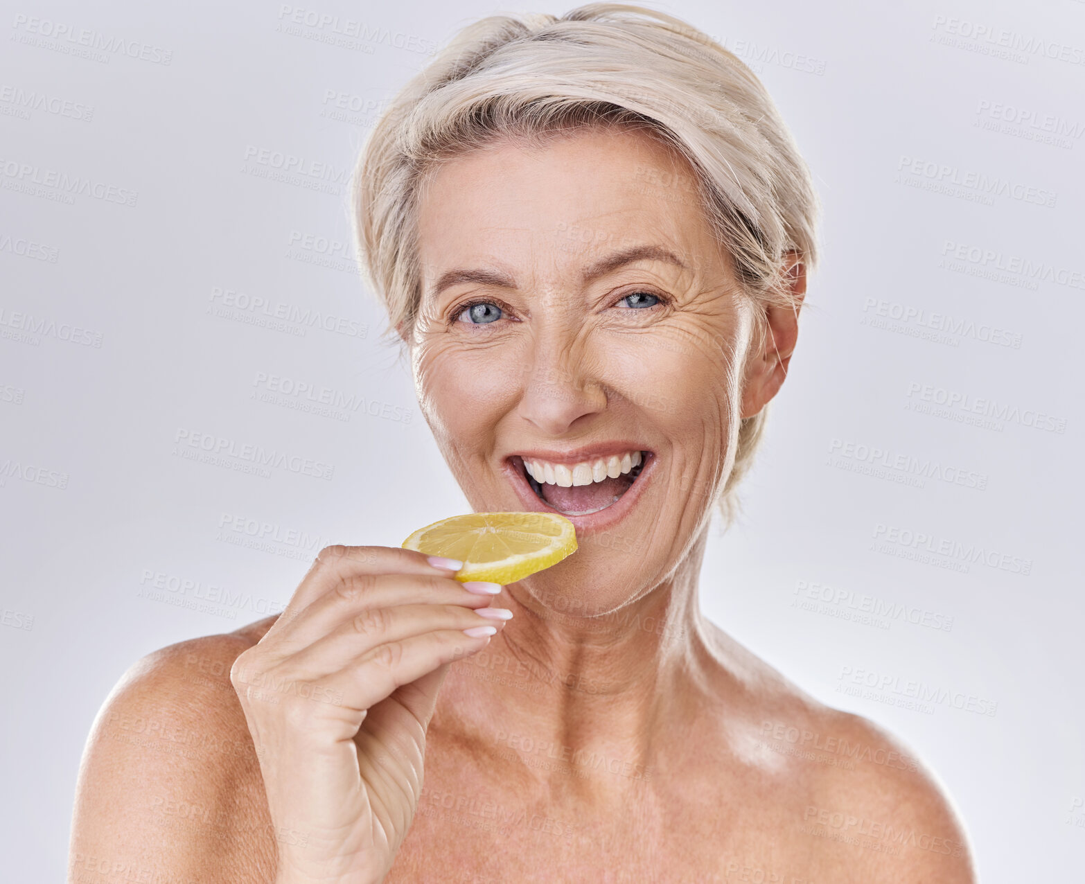Buy stock photo Health, nutrition and wellness of a mature woman happy in her aging skin care, beauty and face. Portrait of an old female model with a lemon promote a healthy natural lifestyle for skincare benefits
