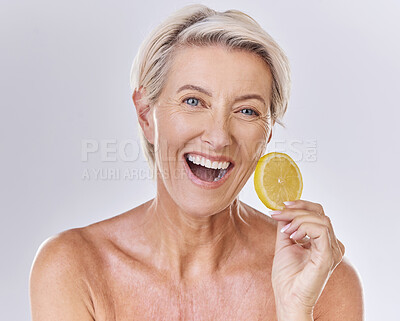 Buy stock photo Skincare, health and face of senior lady with a healthy lifestyle holding an organic lemon. Portrait of a happy mature female with wrinkles doing a fresh citrus fruit body care wellness routine.
