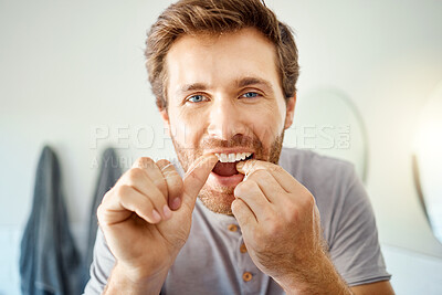 Buy stock photo Teeth, dental floss and portrait of man in bathroom for self care, oral hygiene and morning routine. Cleaning, smile and health with face of male person at home for beauty, wellness and results