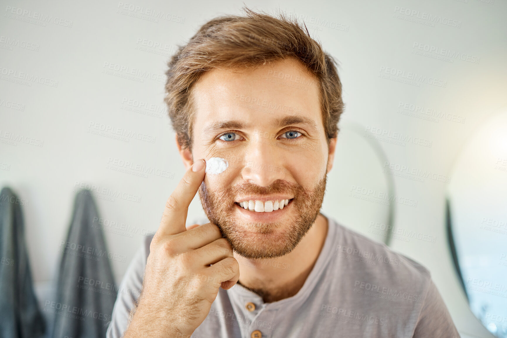Buy stock photo Bathroom, portrait and happy man with skincare cream for acne treatment, skin hydration or home beauty routine. Face cosmetics, dermatology smile or hygiene person with morning sunscreen application