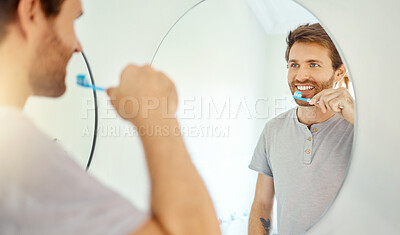 Buy stock photo Brushing teeth, dental and mirror with man in bathroom for self care, oral hygiene and morning routine. Cleaning, smile and health with face of male person at home for beauty, wellness and toothbrush