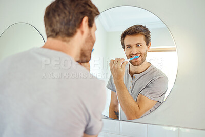 Buy stock photo Brushing teeth, morning routine and mirror with man in bathroom for self care, oral hygiene and dental. Cleaning, smile and health with face of male person at home for beauty, wellness and reflection