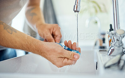 Buy stock photo Hands, toothbrush or man at sink of water, dental hygiene or wellness of gum care at home. Closeup of person washing oral product for brushing teeth, fresh morning routine or cleaning at bathroom tap
