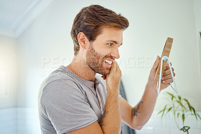 Buy stock photo Man in bathroom, checking face in mirror and smile with morning routine, health and wellness in home. Dental care, clean mouth and teeth with male grooming for fresh breath, hygiene and getting ready