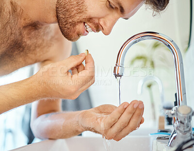 Buy stock photo Bathroom, tap water and man with pills, tablet or morning supplements for healthcare, wellness or medication. Liquid drink, sink and home person eating vitamin for health balance, energy or nutrition