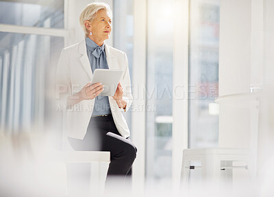 Buy stock photo Elderly business woman, tablet and thinking of company growth statistics, customer experience review or online data. Vision, office work and confident female person, director or boss sitting on desk