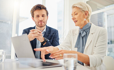 Buy stock photo Office laptop, business people and mentor explaining research data, online sales insight or company system. Teamwork, pointing gesture and senior woman working, teaching or coaching onboarding man