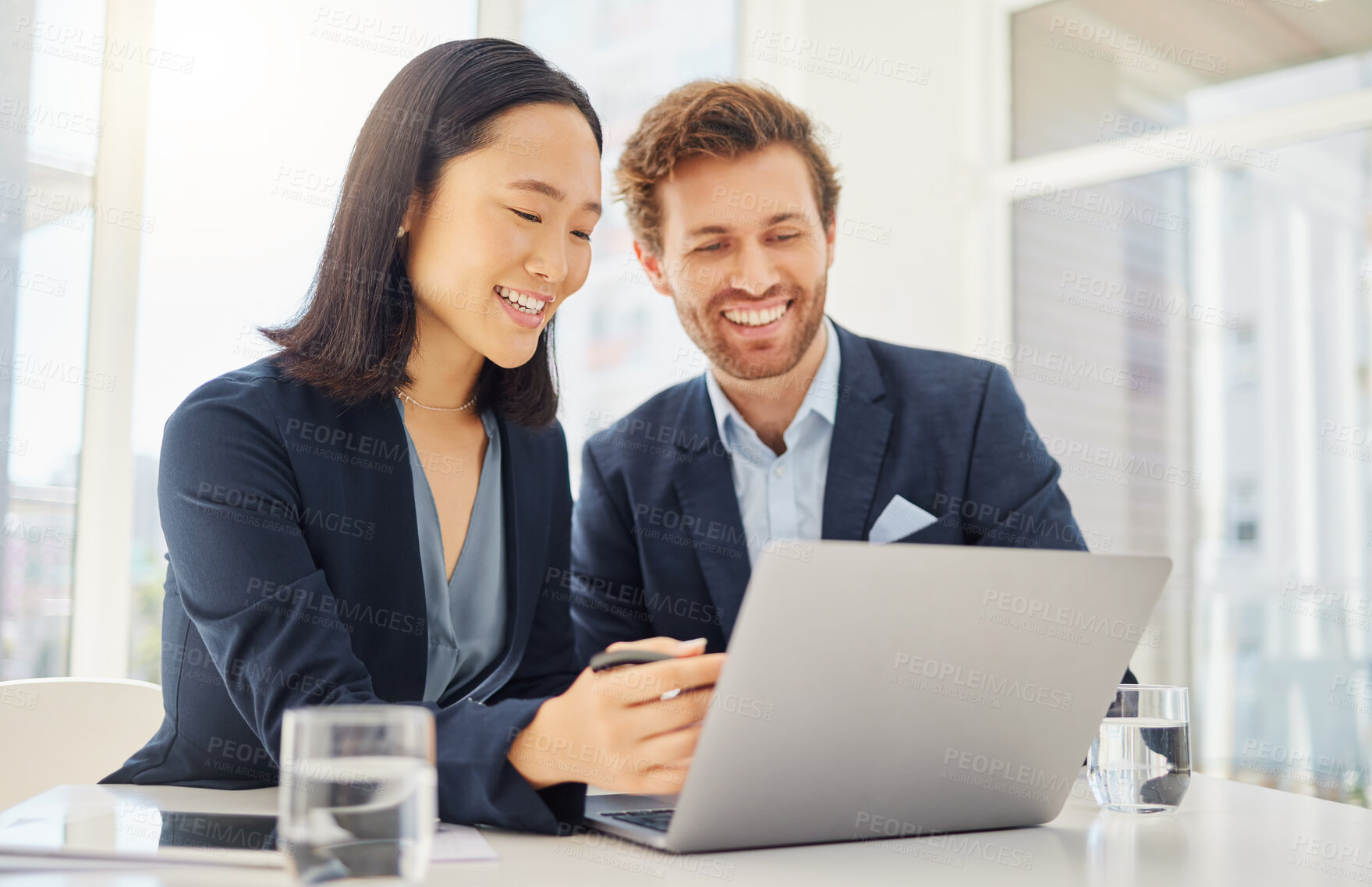 Buy stock photo Business man, woman and laptop for planning, reading and happy with results in modern office. Japanese businesswoman, businessman and computer with diversity, teamwork and collaboration for strategy