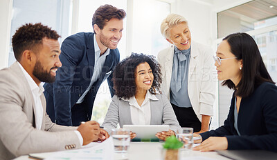 Happy diverse businesspeople listening to a colleague present feedback and ideas during a meeting in an office boardroom. Smiling businessmen and businesswomen having a discussion while brainstorming together