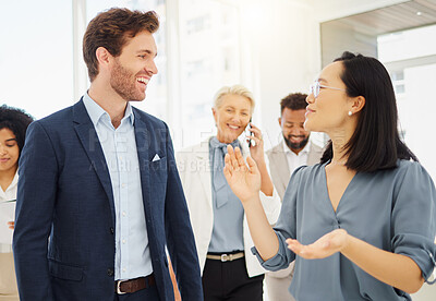 Buy stock photo Lawyers, business people and talking in office, discussion or conversation. Attorney, corporate or happy man and Asian woman speaking, communication or chat for teamwork in company workplace together