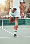 Rear view of one unknown indian tennis player stretching legs and getting ready for court game. Ethnic fit athlete standing alone and holding stretch as warmup before match. Sporty man in sports club