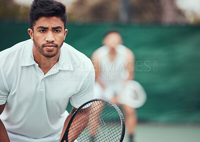 Buy stock photo Male athlete, serious on tennis court for a competition with team and exercise in india. Man, racket and together for game at sports club in the outdoor for fitness with challenge to play in closeup.