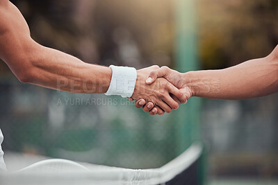 Two unknown ethnic tennis players shaking hands before playing court game. Fit athletes team standing and using hand gesture handshake for good luck. Play competitive sports match for health fitness