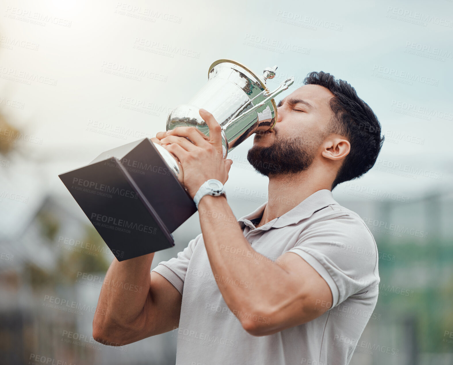 Buy stock photo Man, tennis and kissing trophy in celebration for winning, success or achievement on the court. Male person, athlete or winner in love or kiss on champion award, prize or reward for sport competition