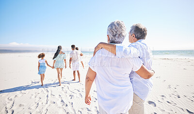 Buy stock photo Big family, sea or old couple walking with children in summer with happiness, trust or peace in nature. Grandparents, back view or senior man bonding with woman or kids taking a walk on beach sand