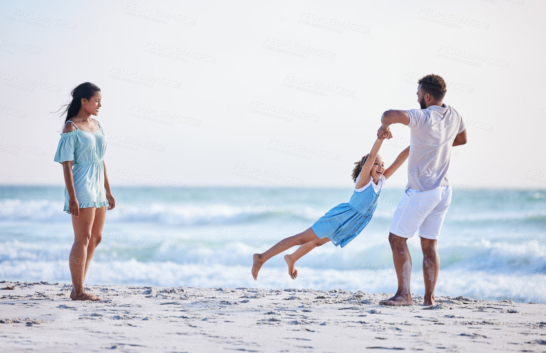 Buy stock photo Mother, beach or father playing with child in air on family holiday, vacation or weekend break together. Parents, mom or dad swinging or bonding with child, daughter or kid at seaside with happiness 