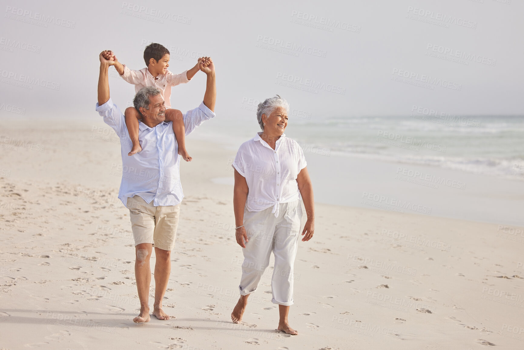 Buy stock photo Family, grandparents walking with child on beach and travel, love and vacation with mockup space and sea view. Senior people with boy, trust and support with tourism in Mexico and bonding together