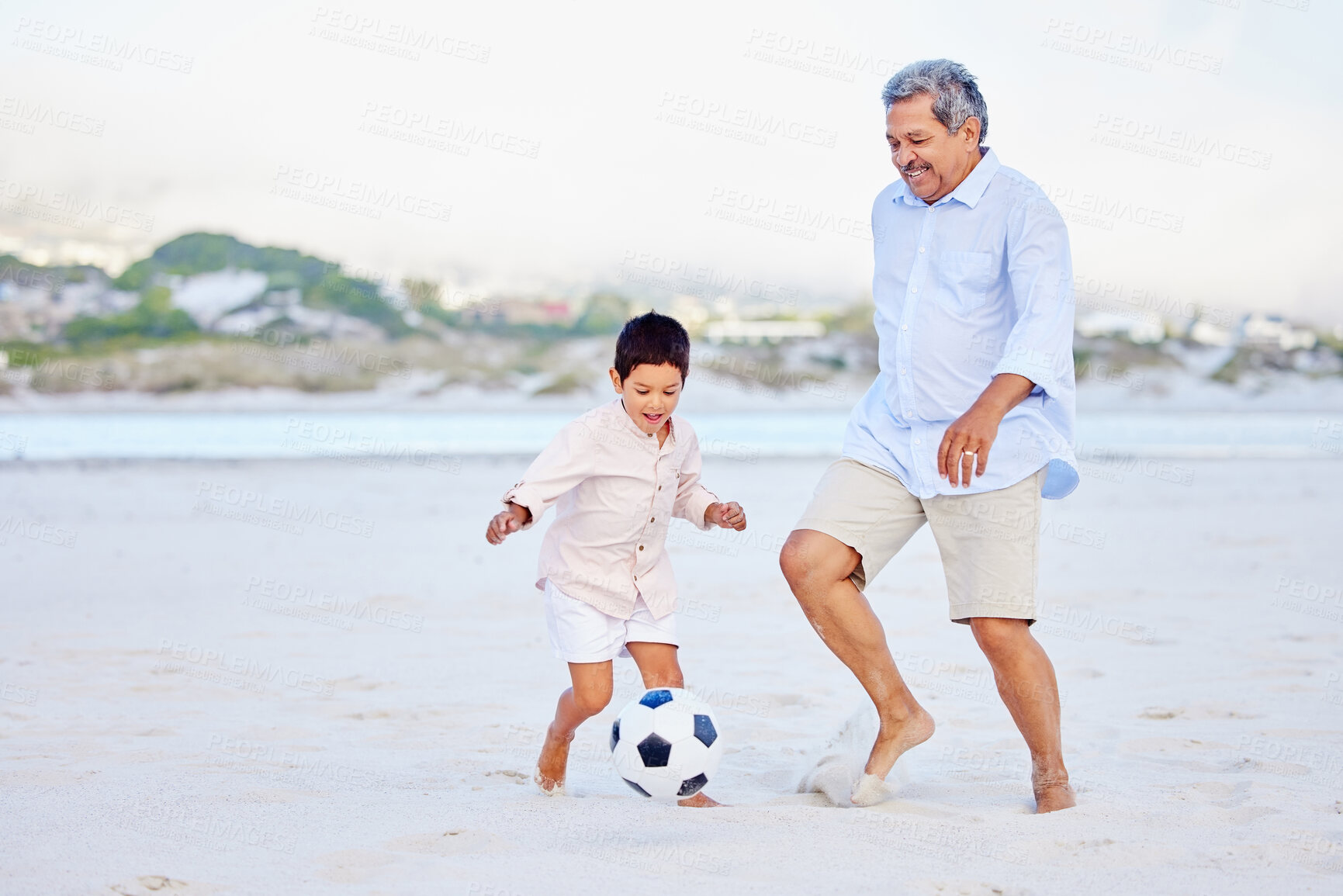 Buy stock photo Beach, soccer and grandfather playing with child on vacation or holiday happy for sand football or sports. Travel, summer and elderly man kicking a ball with kid at the sea or ocean together
