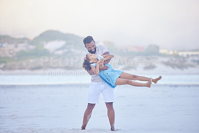 Buy stock photo Happy father and his adorable little girl having fun on the beach. Dad spinning little girl around while enjoying family time by the beach