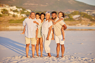 Buy stock photo Full length portrait of a multi generation family on vacation standing together at the beach on a sunny day. Mixed race family with two children, two parents and grandparents spending time together