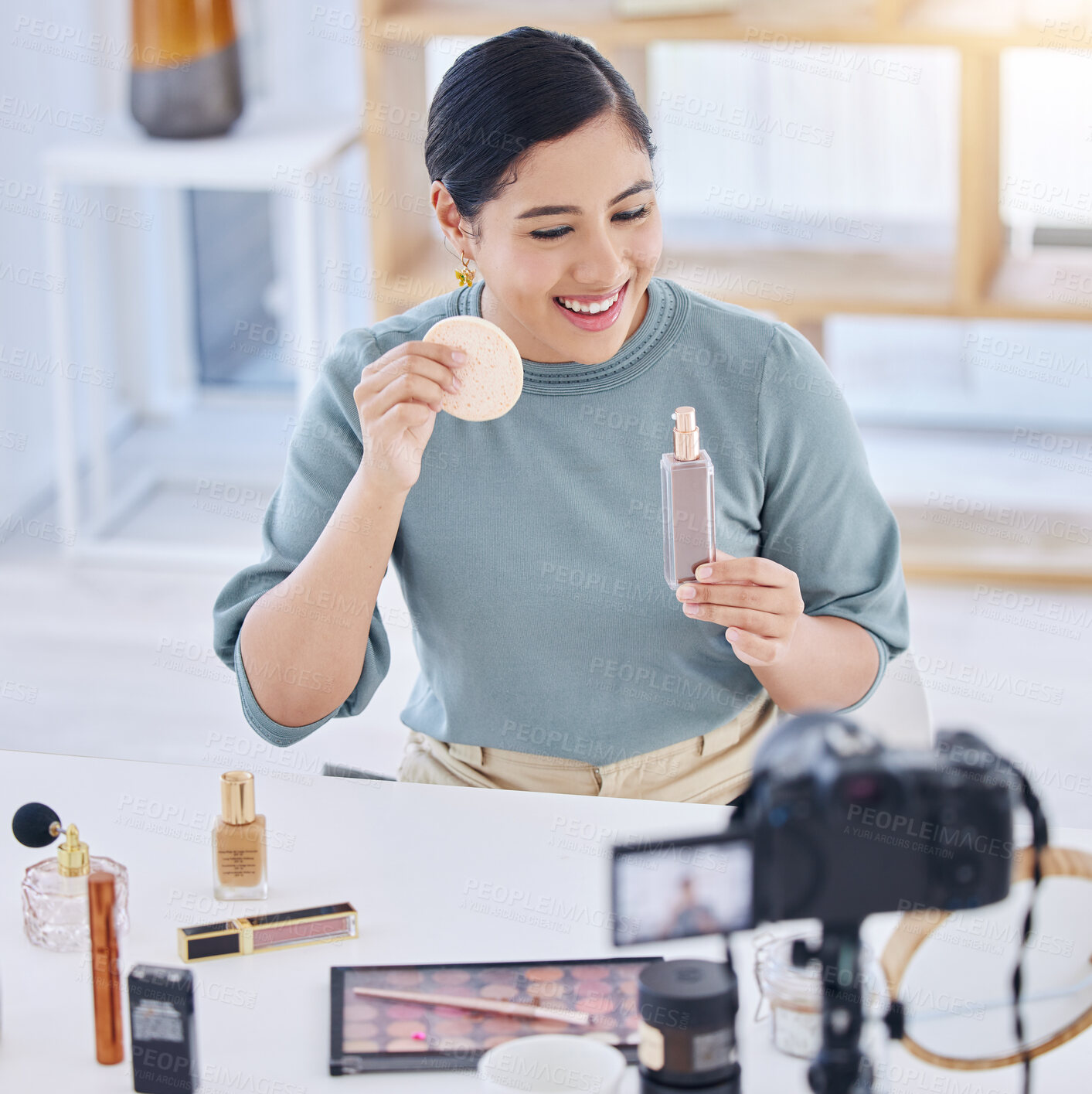 Buy stock photo Makeup, influencer, camera and happy woman streaming tutorial for cosmetics, social media or skincare. Foundation, live stream and content creator with smile, product broadcast and beauty channel