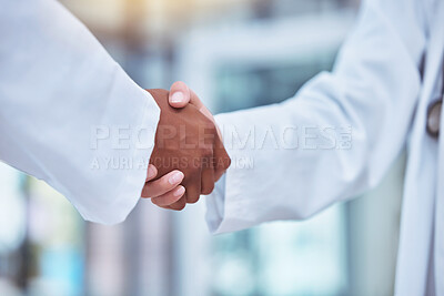 Buy stock photo Closeup, doctors and handshake in hospital for partnership, deal and collaboration for wellness, healthcare and respect. Medic team, shaking hands and welcome for interview, hiring and recruitment