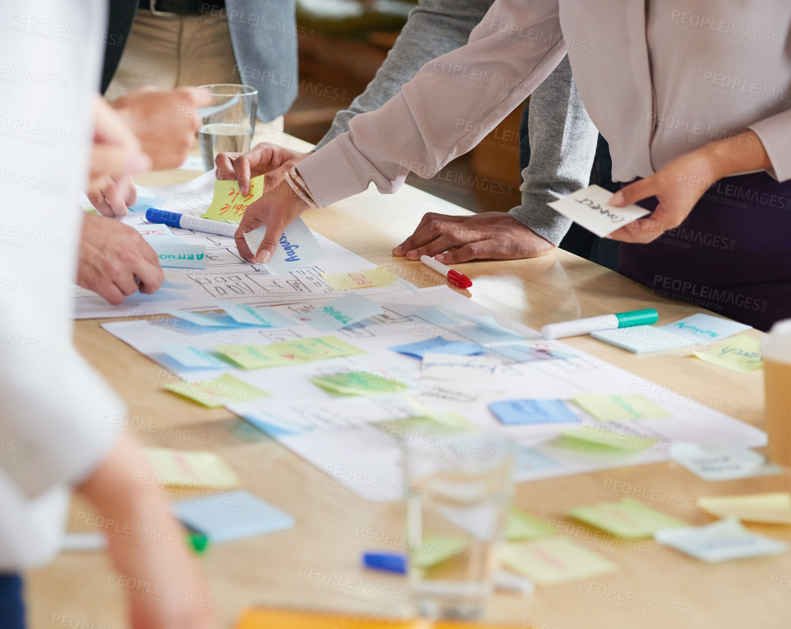 Buy stock photo Hands, team and documents in office with sticky note, planning and mind map for inspiration at company. People, huddle and scrum for brainstorming, group and synergy for solution at creative agency