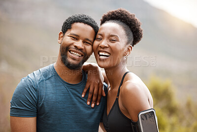 Closeup portrait fit african american couple smiling while exercising outdoors. Young athletic man and woman looking happy while taking a break from a workout outside. They love to exercise together