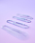 four paperclips on the purple background