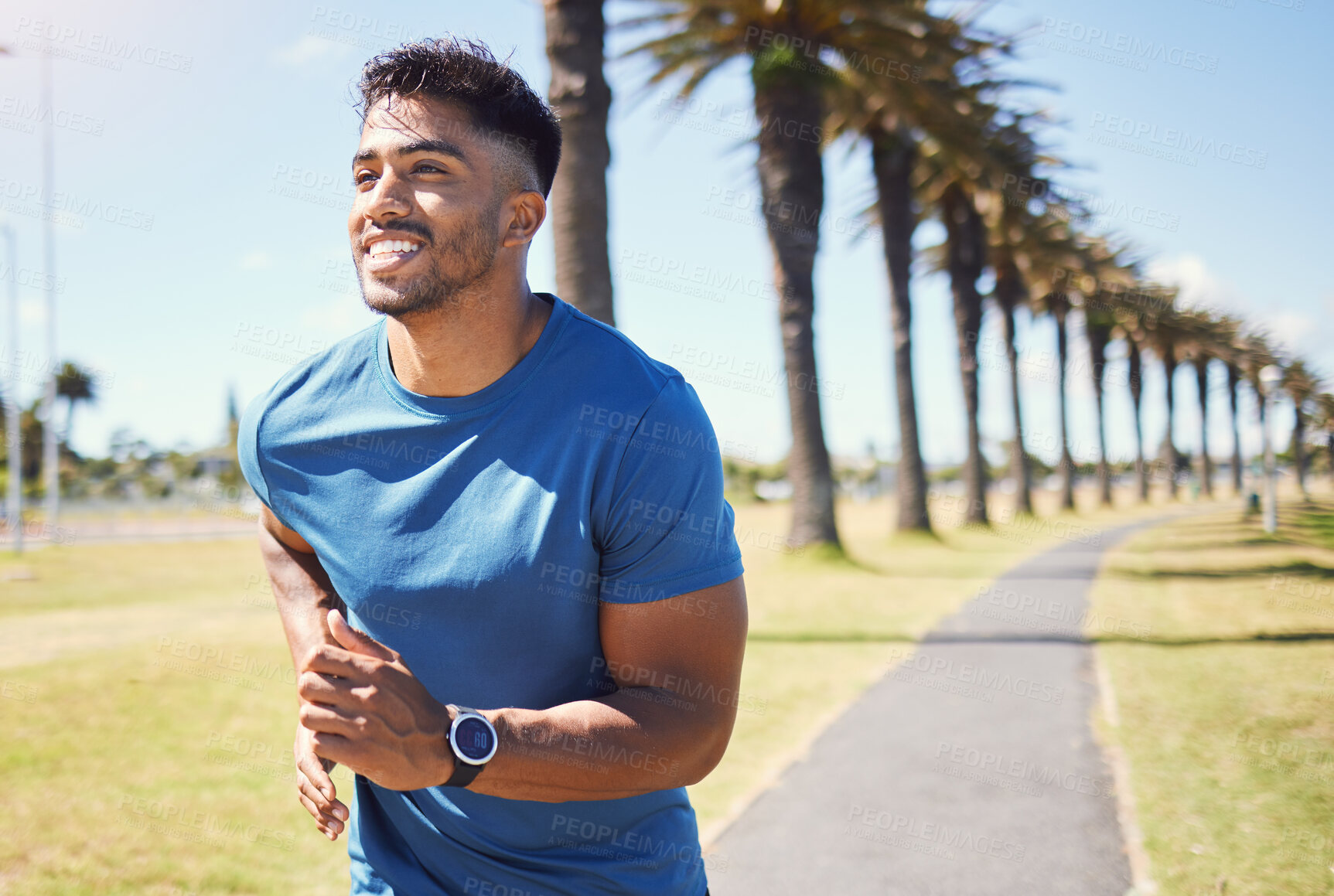 Buy stock photo Fitness, smile and a man or runner outdoor for exercise, training or running at a park. Happy Indian male athlete in nature for a workout, run and cardio performance with a watch for progress or goal