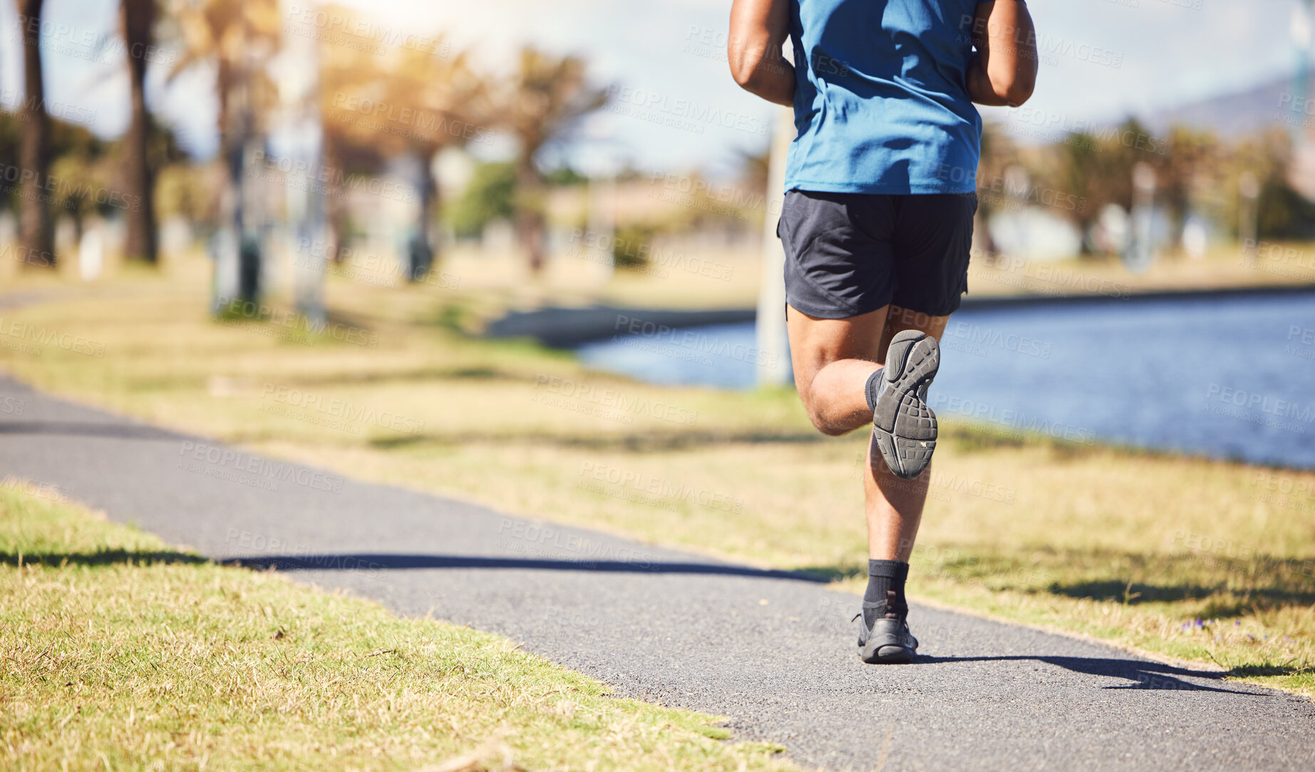 Buy stock photo Fitness, legs and man or runner outdoor for exercise, training or running at a park. Closeup and feet of a male athlete in nature for a workout, run and cardio performance for health and wellness