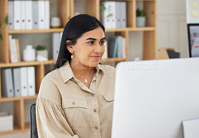 Buy stock photo Business, online or Indian woman typing on computer working on email, proposal or project research. Technology, office feedback or girl journalist writing blog reports or internet articles with focus