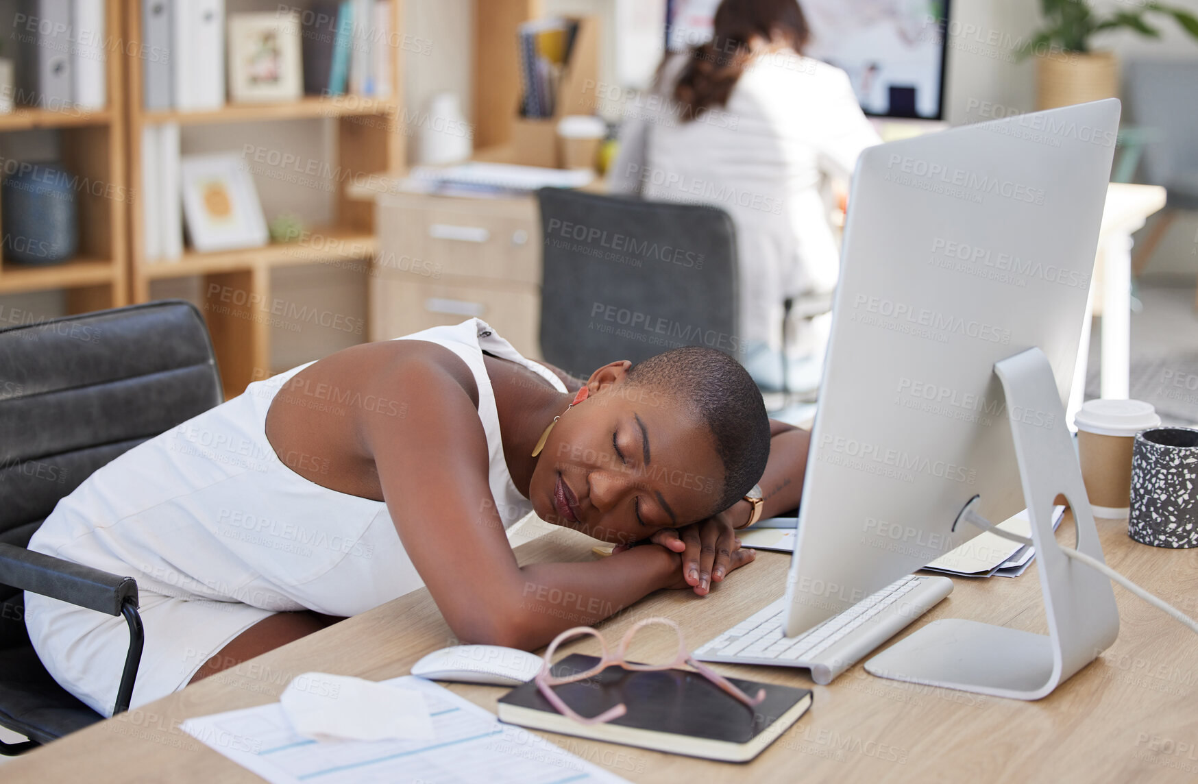 Buy stock photo Office, sleeping or tired black woman resting on table with burnout is overworked by deadlines at desk. Lazy, dreaming or exhausted worker with stress or fatigue napping on relaxing break in overtime