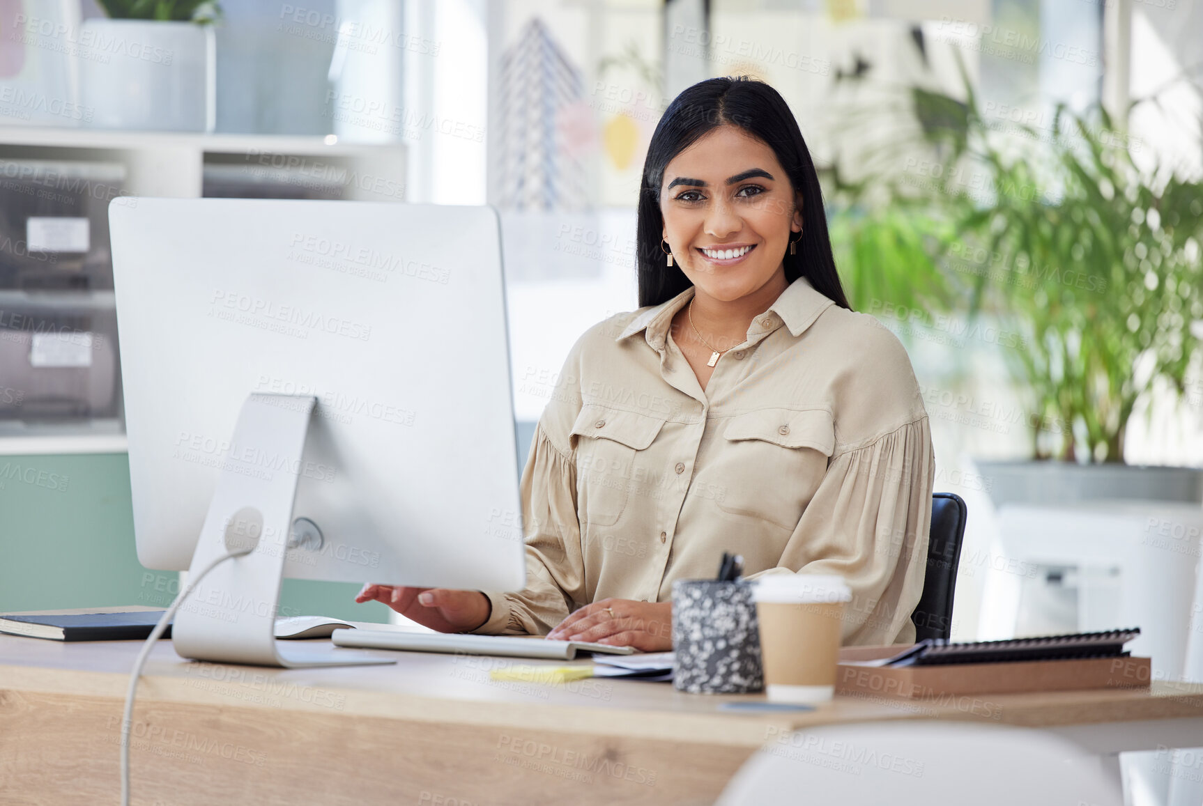 Buy stock photo Portrait, happy or Indian woman at a desk typing an email, planning schedule or company goals. Administration, smile or computer of proud Human Resources manager, corporate person or worker in office