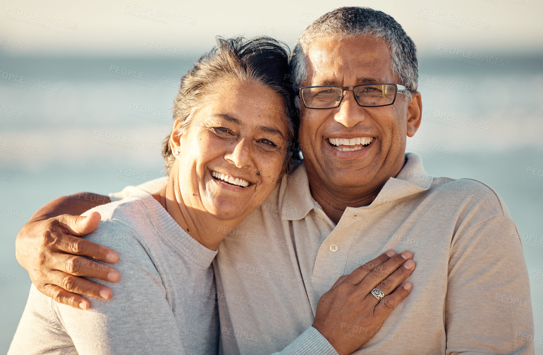 Buy stock photo Senior happy couple, beach and hug in portrait with love, care and outdoor in summer sunshine on romantic walk. Elderly woman, old man and smile together with happiness, vacation or holiday by sea