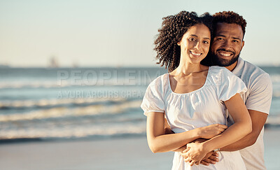 Buy stock photo Love, hug and portrait of couple at beach for summer holiday, vacation and romantic date. Travel, happy and mixed race man and woman hugging, embrace and smile for bonding, relax and honeymoon by sea