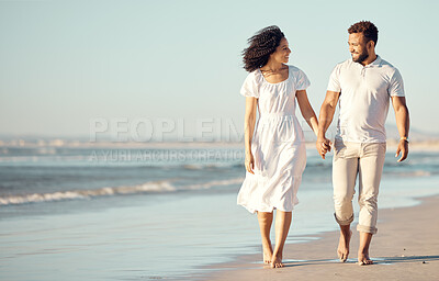 Buy stock photo Love, travel and couple walking at beach for summer holiday, vacation and romantic date. Happy, dating and mixed race man and woman walk by ocean at sunset for bonding, relax and honeymoon in nature