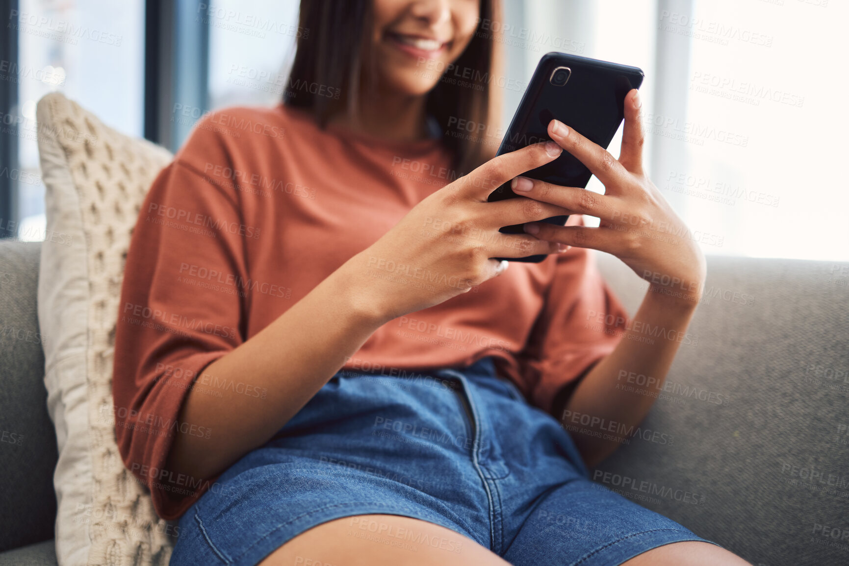 Buy stock photo Woman, hands and phone for social media in home, typing and scroll on dating app for love search. Female person, communication and website for online shopping, reading ebook and relax in lounge
