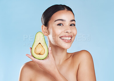 Buy stock photo Natural skincare product, woman healthcare wellness lifestyle and fresh green avocado fruit. Happy face of young girl smile, food nutrition and healthy eating diet portrait on blue background