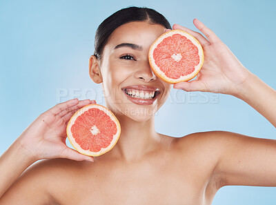 Buy stock photo Beauty, health and woman with clear skin and a grapefruit with nutrition and vitamins in a studio. Girl with a healthy, wellness and fresh skincare and selfcare routine with organic citrus fruit.