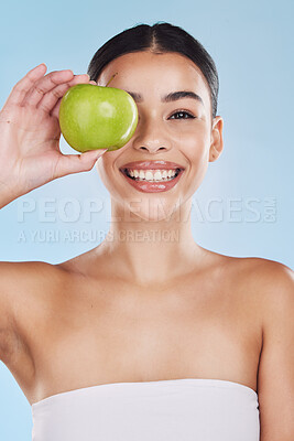Buy stock photo Portrait, health and beauty with woman with an apple for vitamins, minerals or nutrients. Healthy diet, lifestyle and skincare nutrition of girl from Brazil with fruit on her eye and a smile.