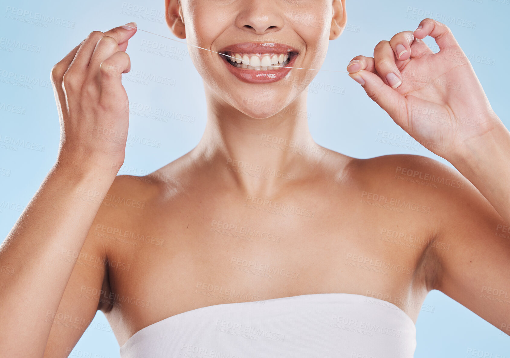 Buy stock photo Dental floss, teeth and healthy smile with a beautiful young woman flossing for oral hygiene and gum health. Closeup of a happy female cleaning her mouth during her selfcare wellness routine